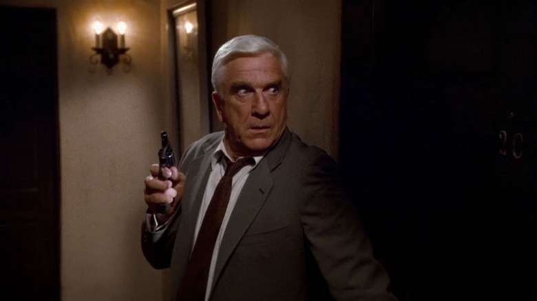 Leslie Nielsen with gun