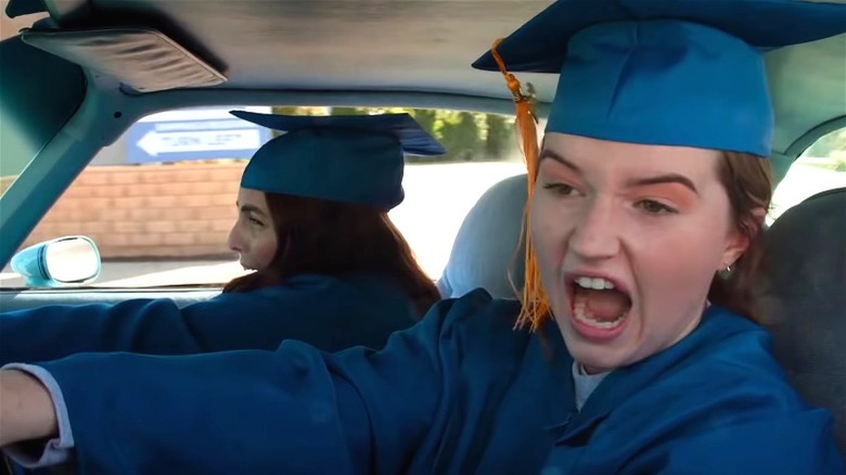 Kaitlyn Dever driving