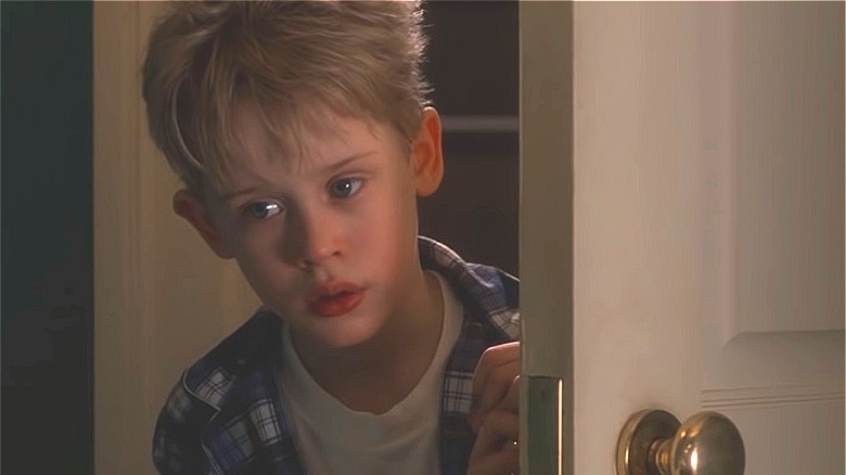 Macaulay Culkin opening door