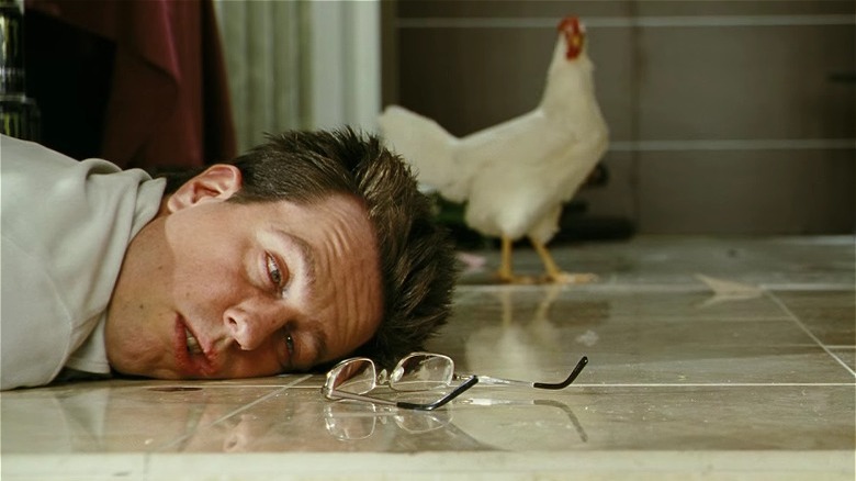 Ed Helms with a chicken