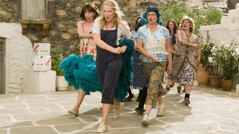 A group of women march in a synchronized performance