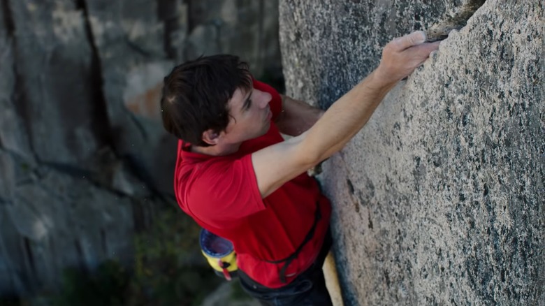 Alex Honnold climbing cliff