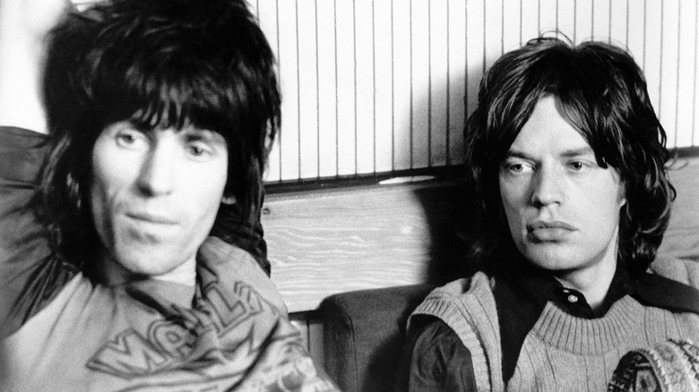 Keith Richards and Mick Jagger sitting