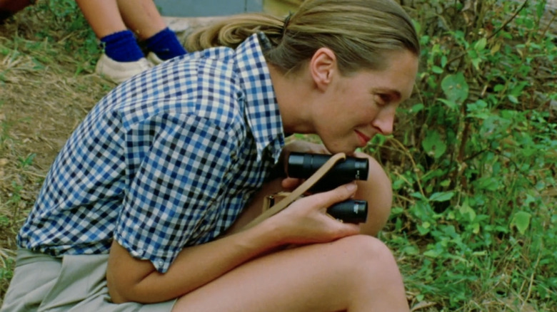 Jane Goodall holding binoculars