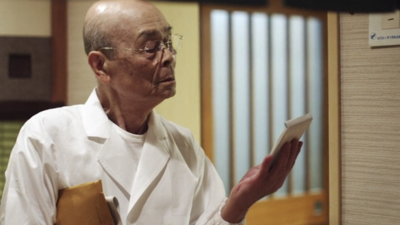 Jiro Ono studies order pad