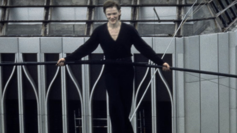 Philippe Petit stepping on tightrope