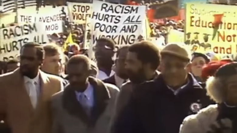 crowd protests racism