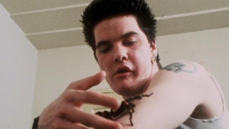 Darby Crash with spider crawling on arm