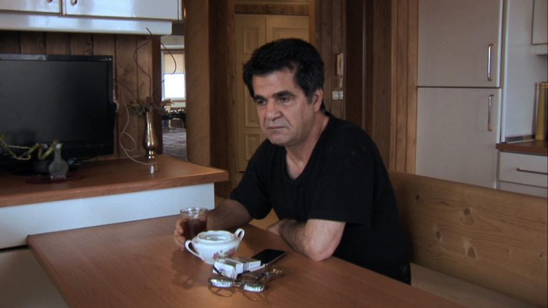 Jafar Panahi sitting at table