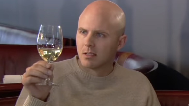 Expert examines wine