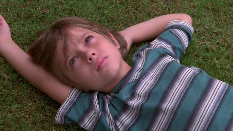 Mason Evans lying on grass