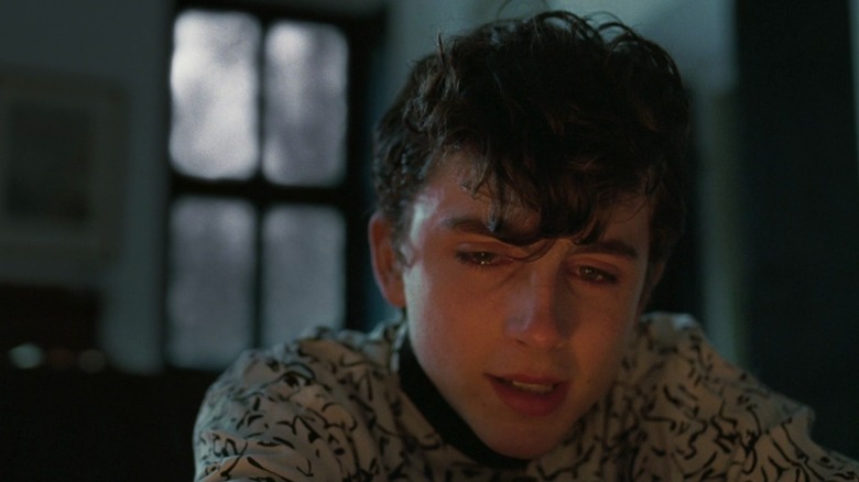 Elio Perlman crying by fire