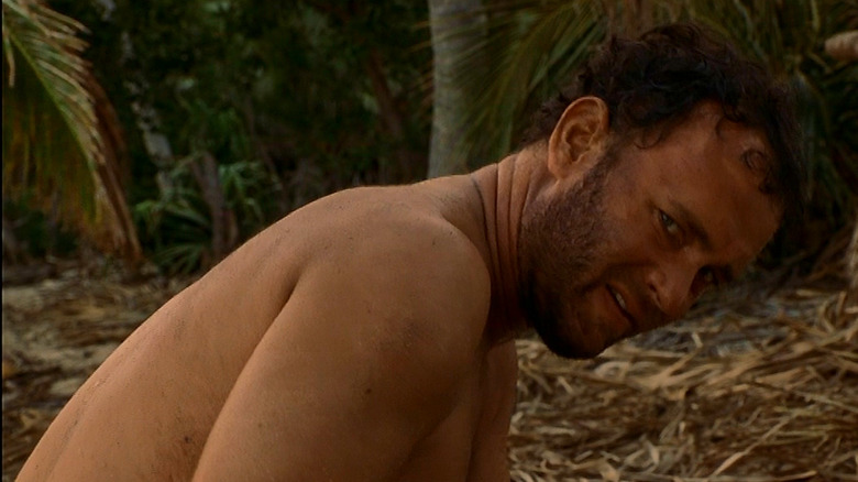 Shirtless Chuck Noland on beach