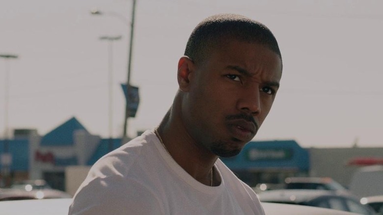 Adonis Creed squinting outdoors