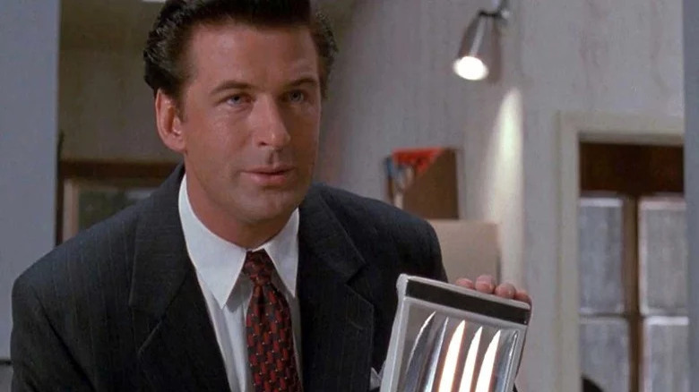 Alec Baldwin holding knives