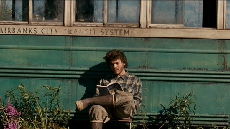 Emile Hirsch sitting outside bus