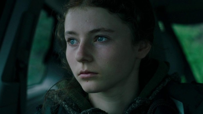 Thomasin McKenzie looks out window