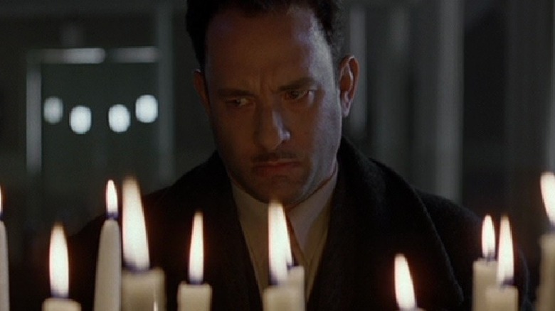 Tom Hanks behind candles