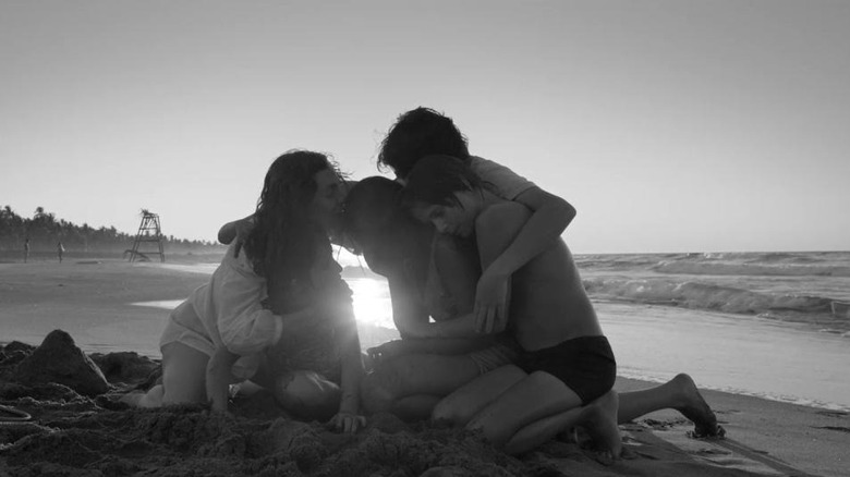 Family on beach in Roma