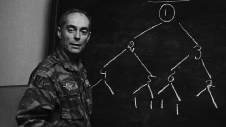 Soldier in front of blackboard 