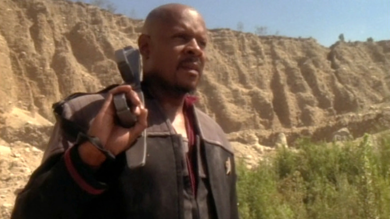 Sisko carries a phaser rifle