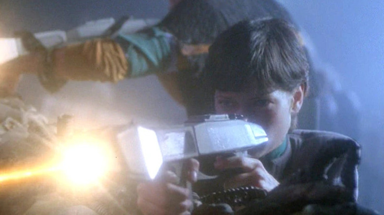 Ezri fires a phaser rifle