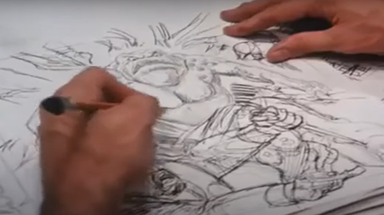 Jim Korman's hands drawing monster