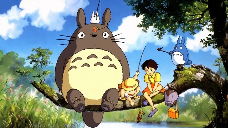 Totoro and children sit on branch