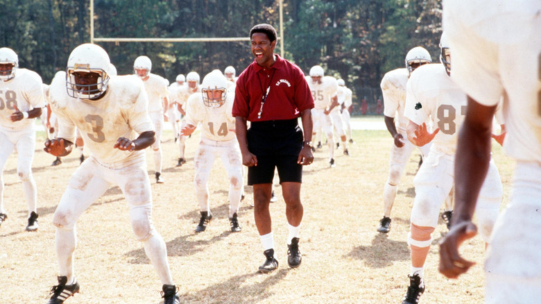 Coach Boone with football team