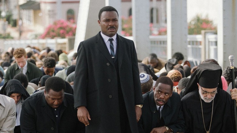 MLK stands in front of kneeling crowd