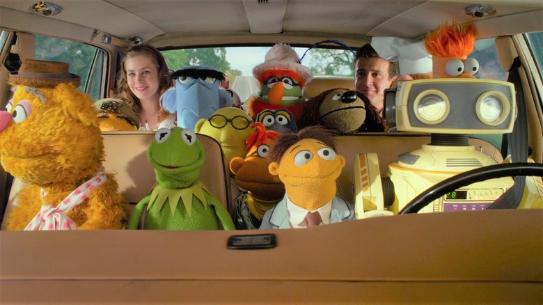 Muppets in car with Mary and Gary