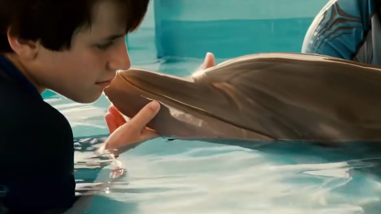 Nathan Gamble with dolphin