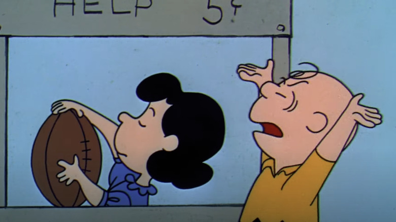 Charlie Brown arguing with Lucy 