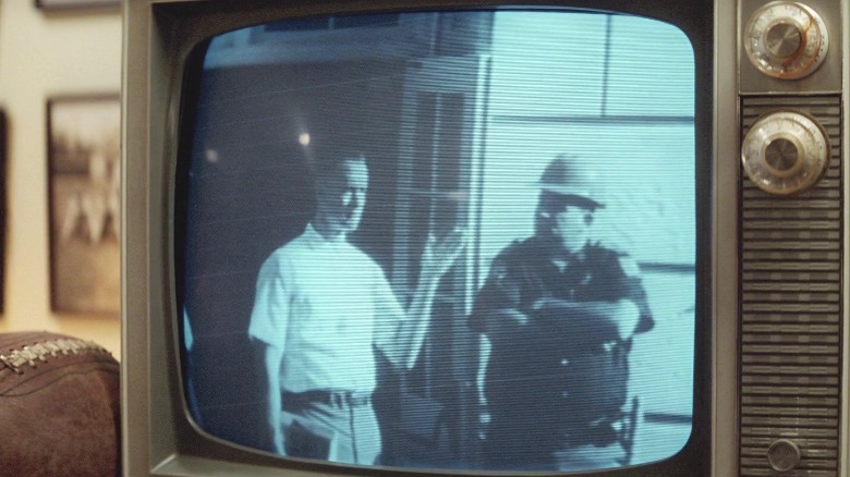 Forrest waving on TV