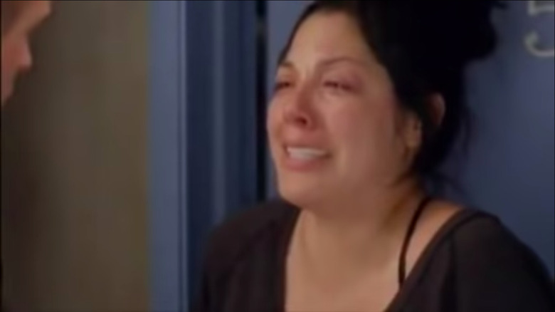 Callie crying in front of door