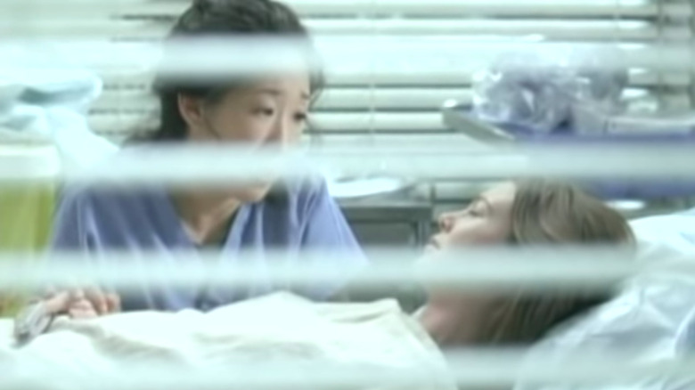 Cristina at Meredith's bedside