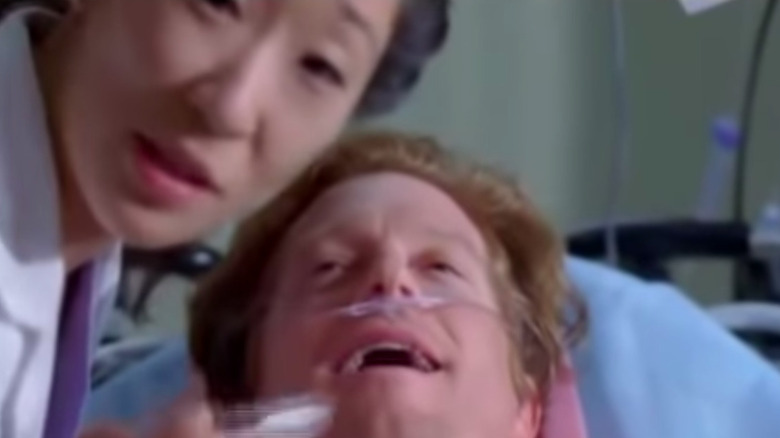 Cristina leaning over patient