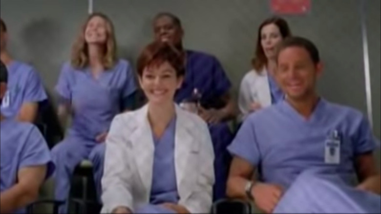 Karev and Meredith laughing in gallery