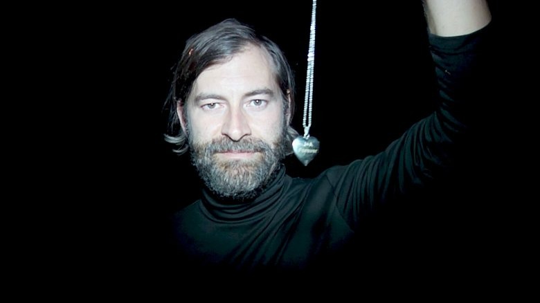 Mark Duplass holding locket