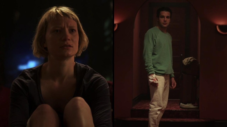 Mia Wasikowska and Christopher Abbott staring