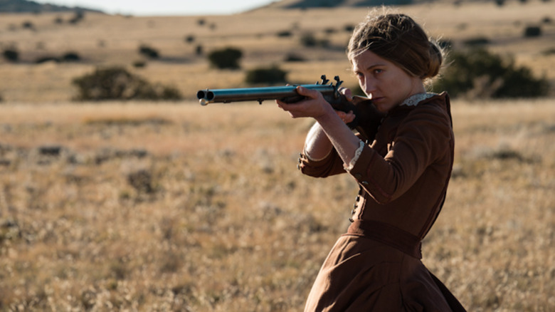 Pioneer woman holding a rifle