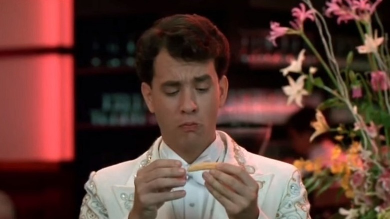 Tom Hanks eating tiny corn