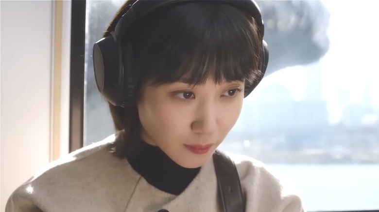 Attorney Woo wearing headphones