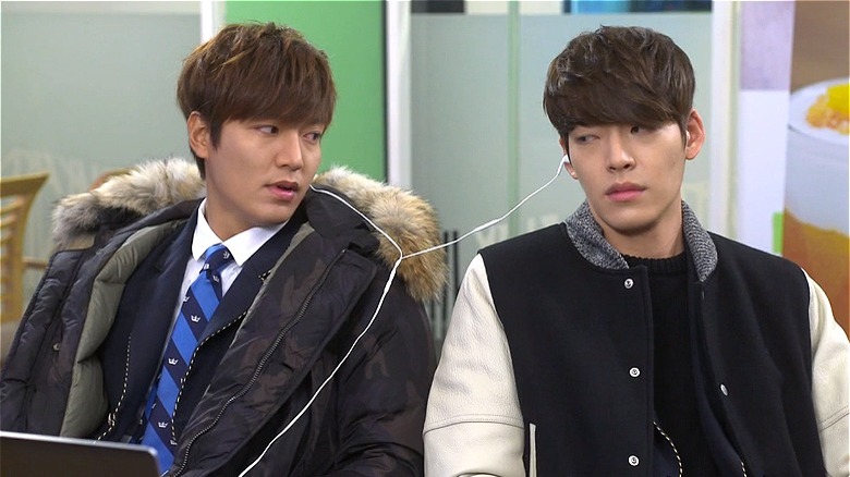 Kim Tan and Young-do sharing earbuds