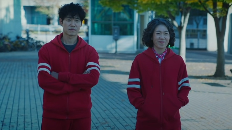 Ga Mo-tak and Choo Mae-ok in red tracksuits