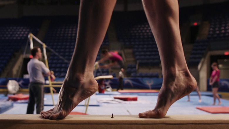 Candice walks on the balance beam in Final Destination 5