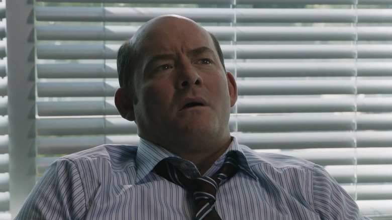 David Koechner leans back in Final Destination 5