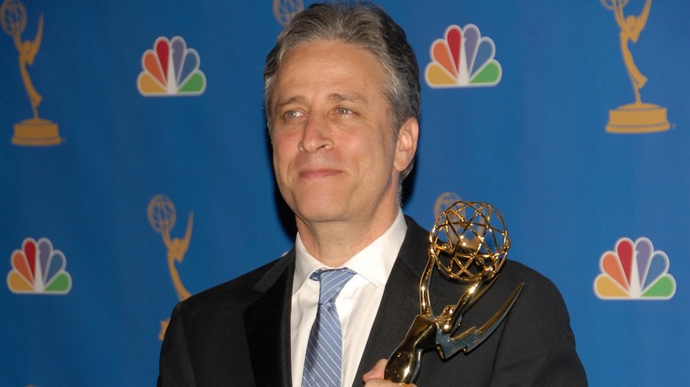 Jon Stewart holding Emmy Award