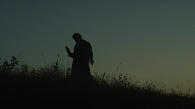 John Brown silhouetted on hill