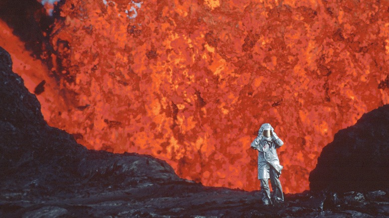 Katia Krafft in front of an erupting volcano